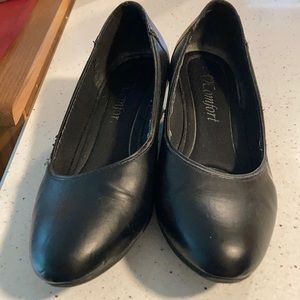 Slightly worn flats with small wedge heel.